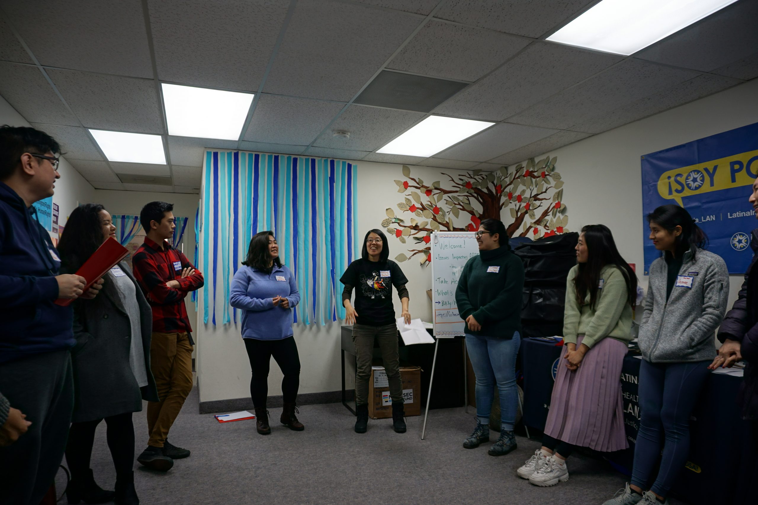 NAKASEC VA staff and community members standing in a circle