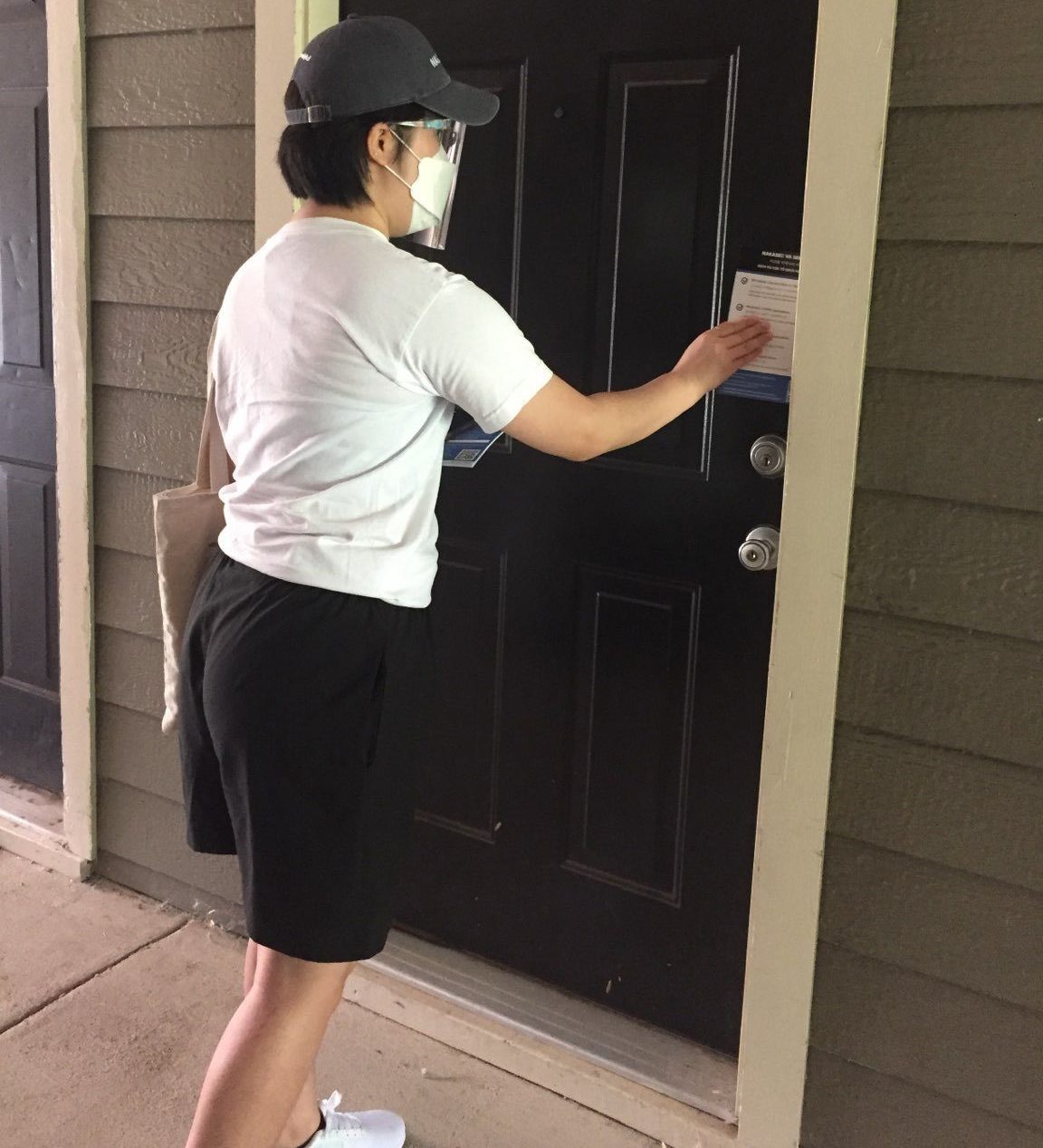 NAKASEC VA's Summer 2021 NLC intern Hana Cho leaving canvassing materials at a door