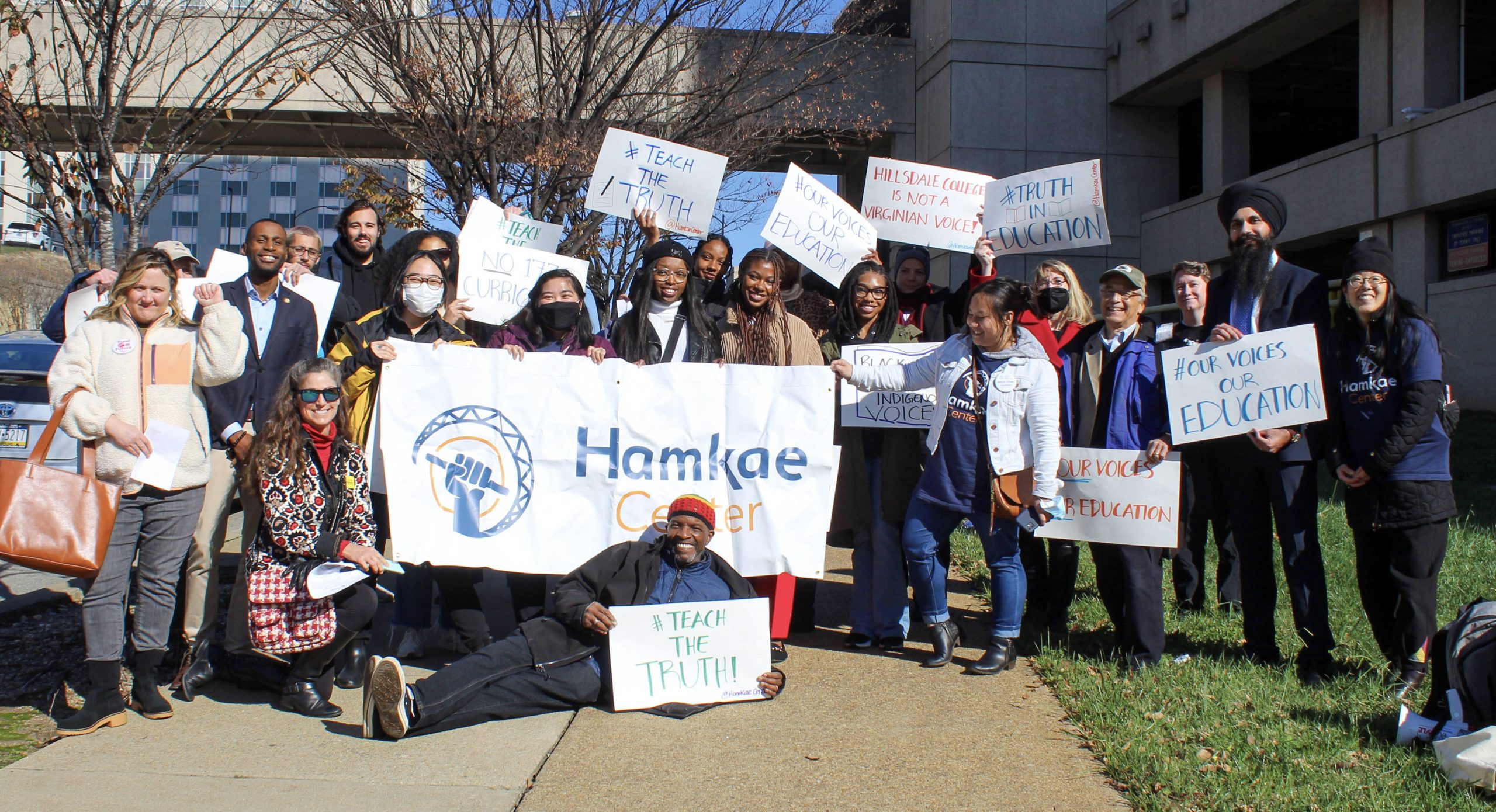 Group photo of attendees with their signs at the Rally for Our Voices, Our Education in Richmond, VA on November 17, 2022.